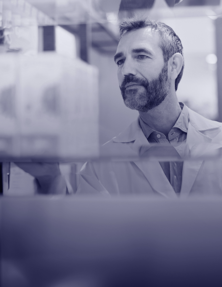 Pharmacist examining Pfizer prescription medication